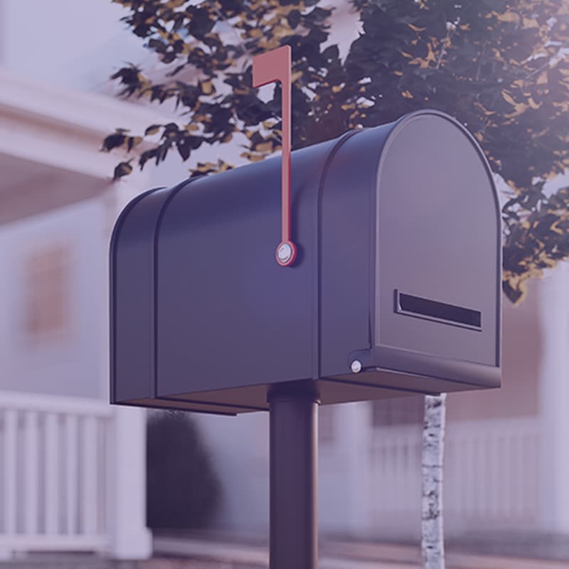 Black mail box outside a house