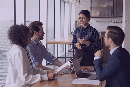 A group of business professionals having a discussion in a meeting room