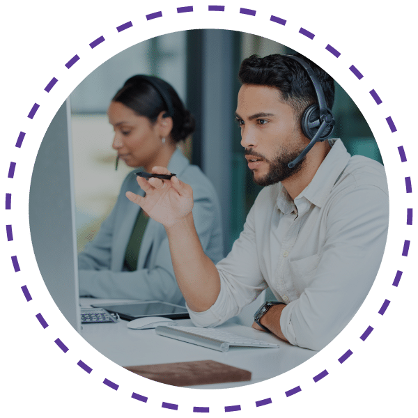 Business man wearing headphone in from of the pc is pointing towards screen in the office